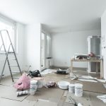 Home renovation in room full of painting tools