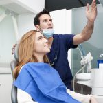 Dentist and patient looking at the monitor